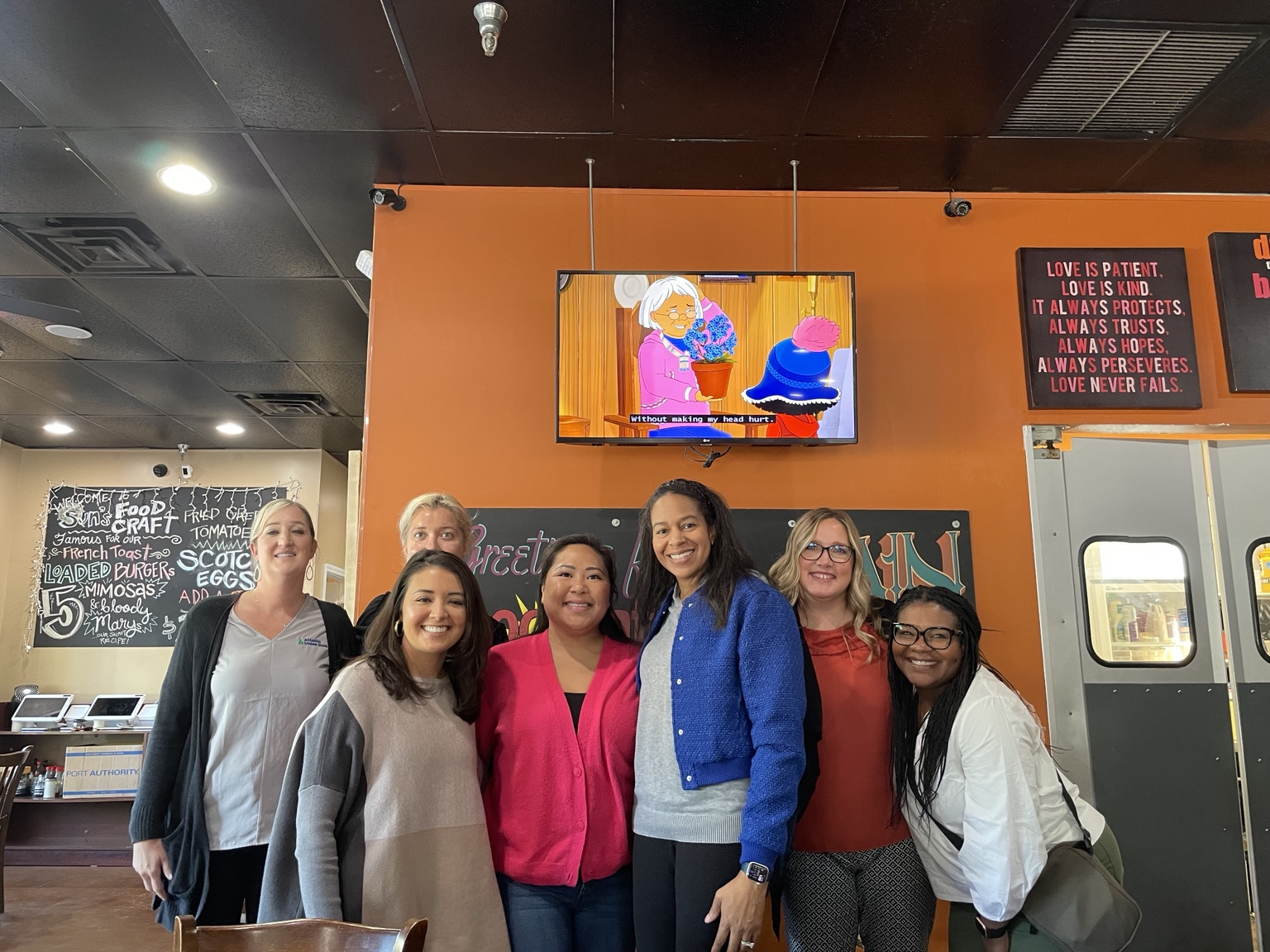 Women in the HER Influence community gathered at a local women-owned restaurant
