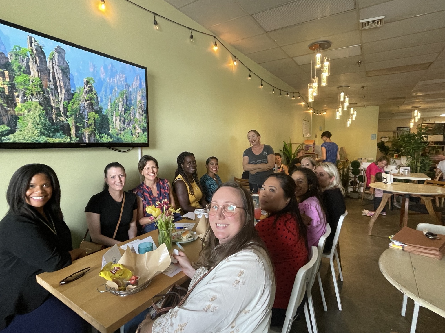 Women connecting at a HER Influence gathering