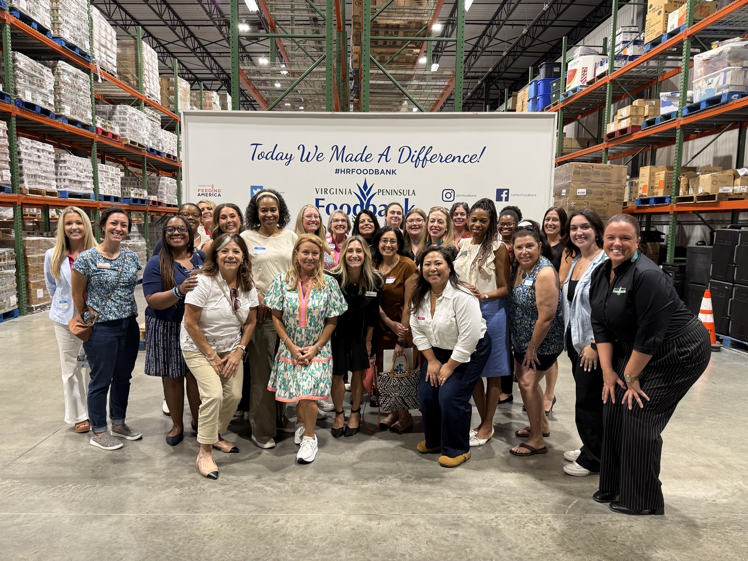 Women in the HER Influence community creating impact together at the Virginia Peninsula Foodbank